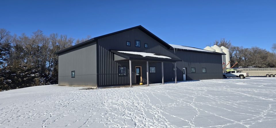 Finished Oakmont dark metal shop and living space on a snowy Midwest site